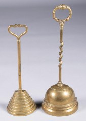 TWO ENGLISH BRASS DOORSTOPS, L