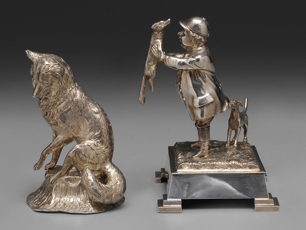 Two English Silver Fox Figures