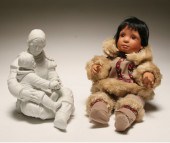 Two Eskimo figures, one porcel