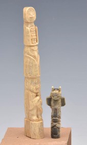 TWO ESKIMO TOTEM POLES.Two Esk