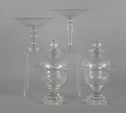 Two etched colorless glass compotes