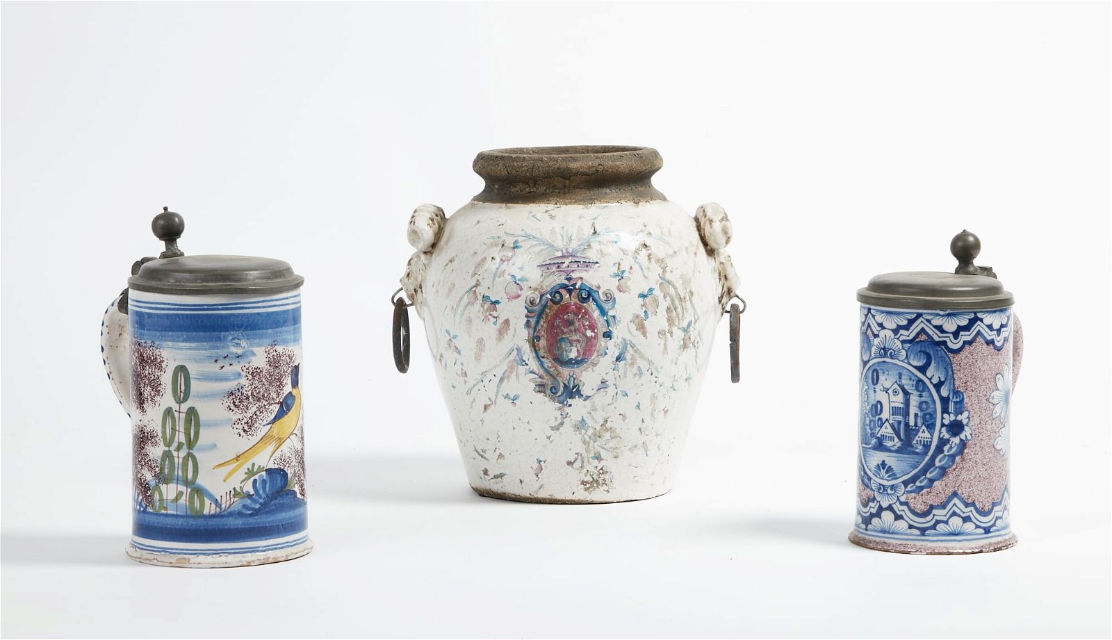 TWO FAIENCE LIDDED TANKARDSTwo