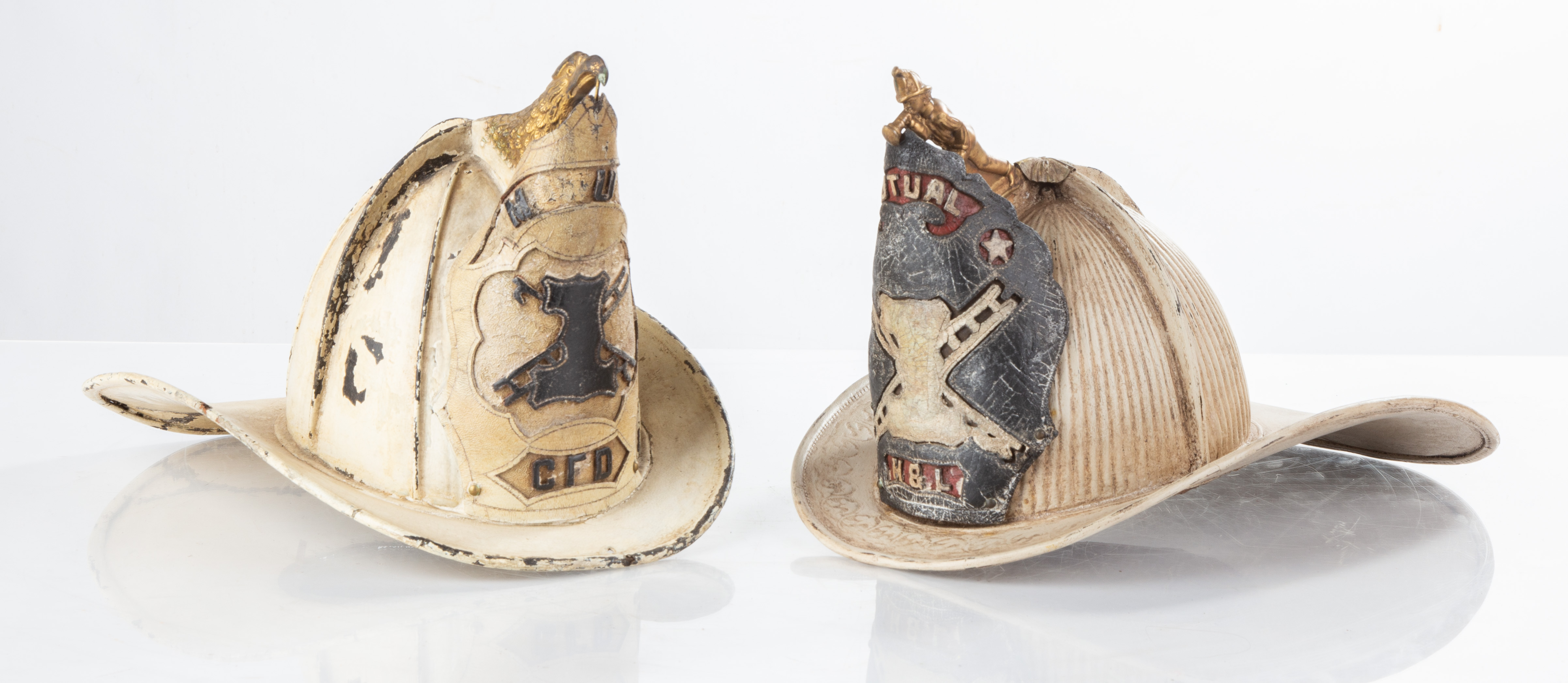 TWO FIREMAN LEATHER HELMETS 19th