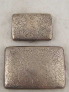 Two flat curved cigarette cases a