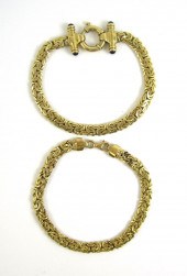 TWO FOURTEEN KARAT GOLD BYZANT