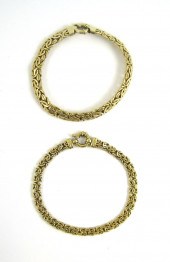 TWO FOURTEEN KARAT GOLD BYZANT
