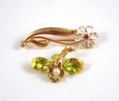 TWO FOURTEEN KARAT GOLD FLOWER