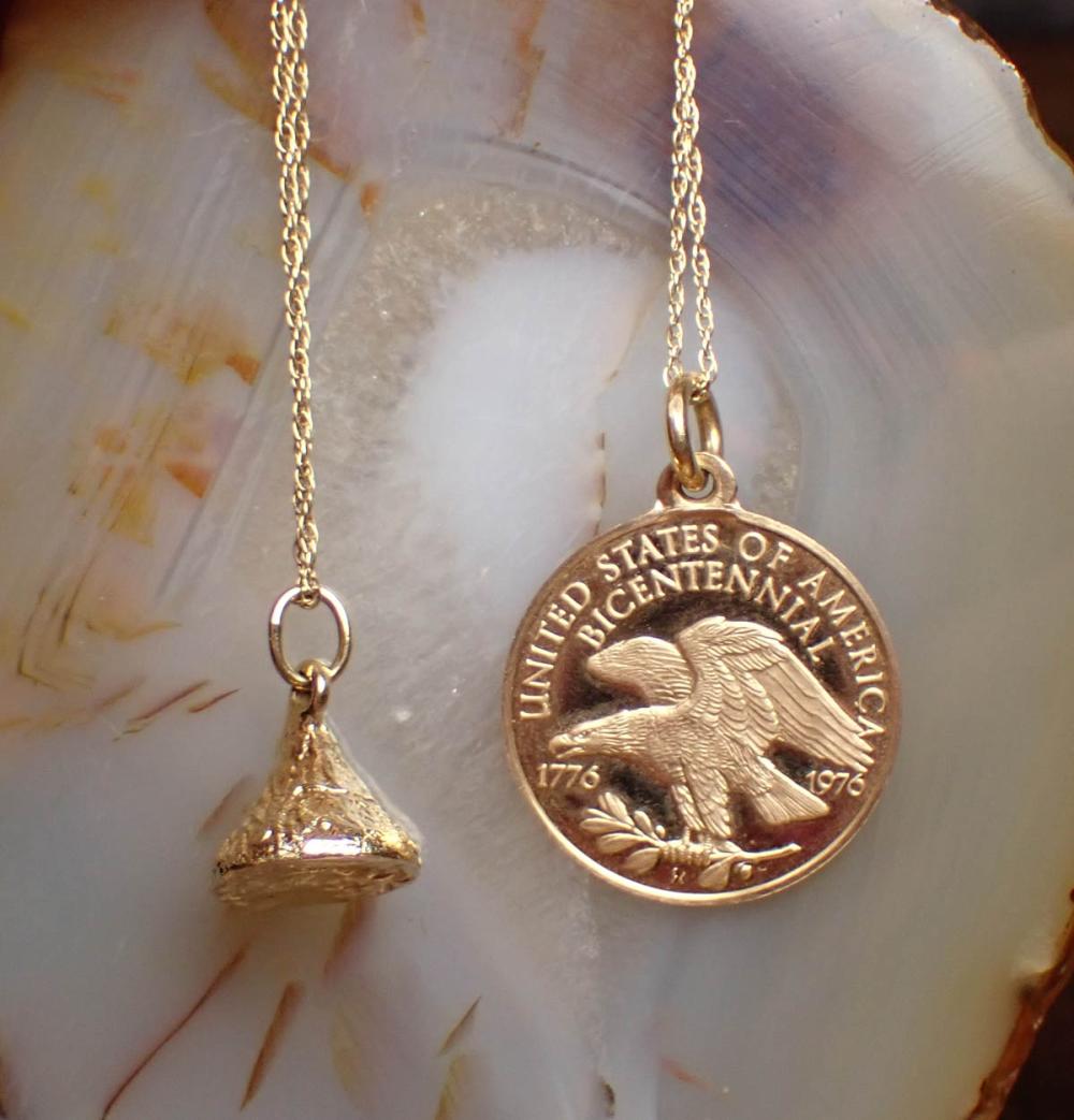 TWO FOURTEEN KARAT GOLD PENDANT