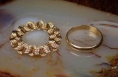 TWO FOURTEEN KARAT YELLOW GOLD