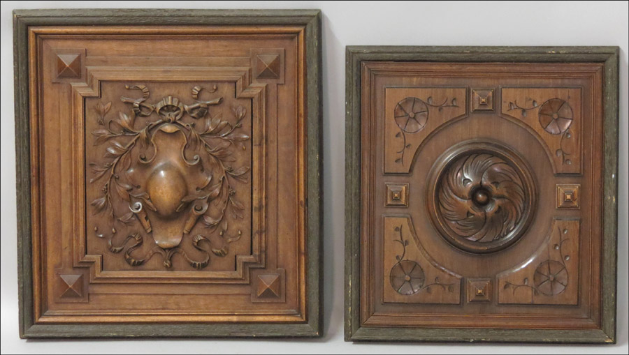 TWO FRAMED CARVED WOOD PANELS.