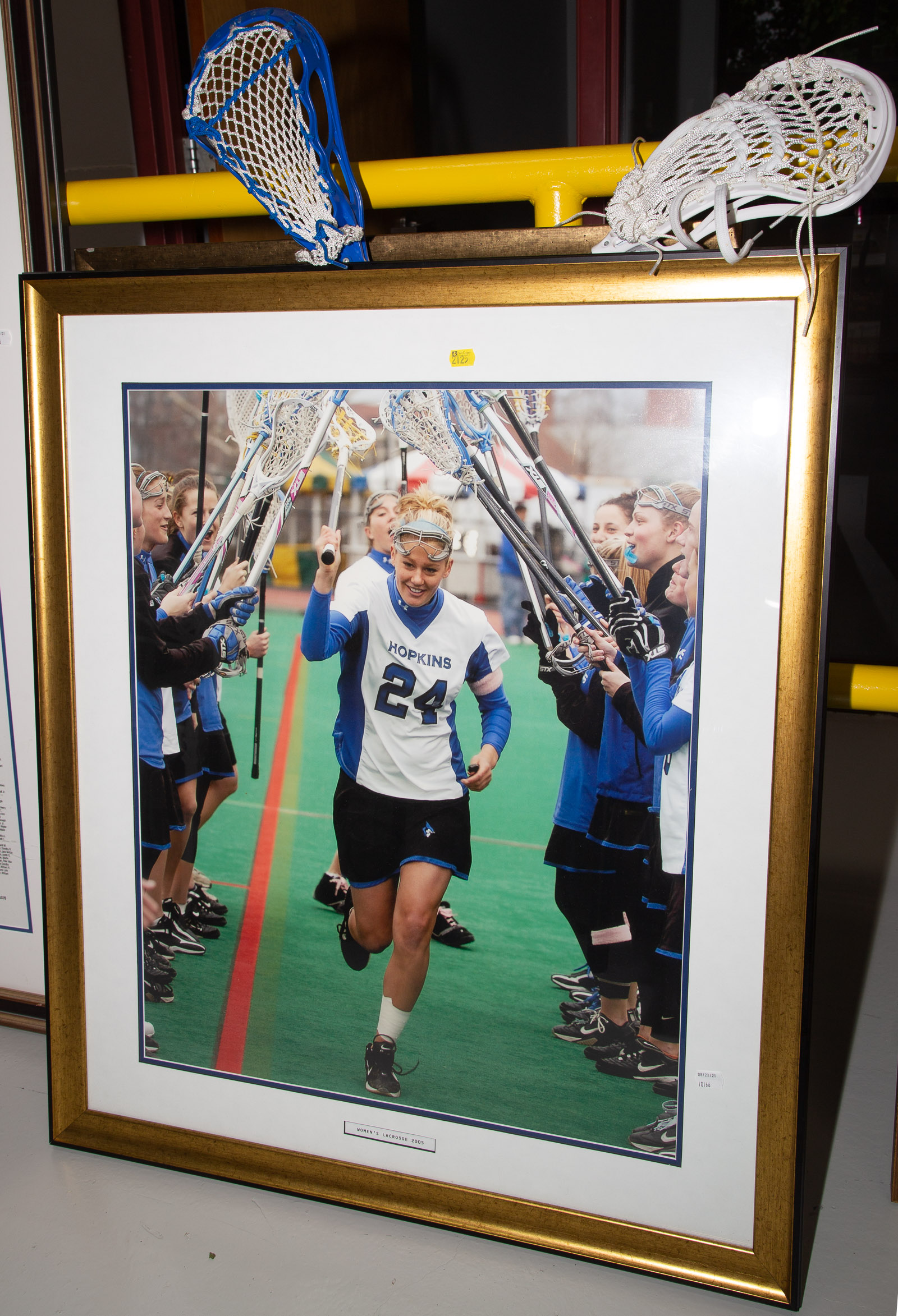 TWO FRAMED JHU WOMEN'S SPORTS