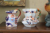TWO GAUDY IRONSTONE PITCHERS.