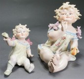 TWO GERMAN BISQUE PIANO DOLLS