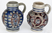 TWO GERMAN STONEWARE JUGS, 17T