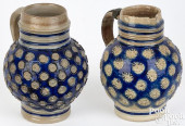 TWO GERMAN STONEWARE JUGS, 17T