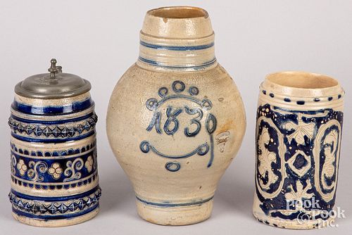TWO GERMAN STONEWARE TANKARDS AND A