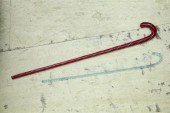 TWO GLASS CANES. Deep red with