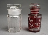 TWO GLASS LIDDED JARSTwo Glass