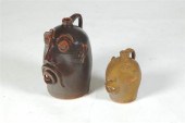 TWO GROTESQUE JUGS.  Made by B