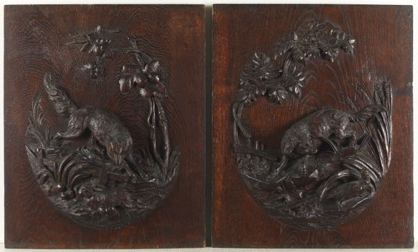 TWO HAND CARVED WALL PLAQUES OF