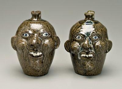 Two Harold Hewell face jugs: both