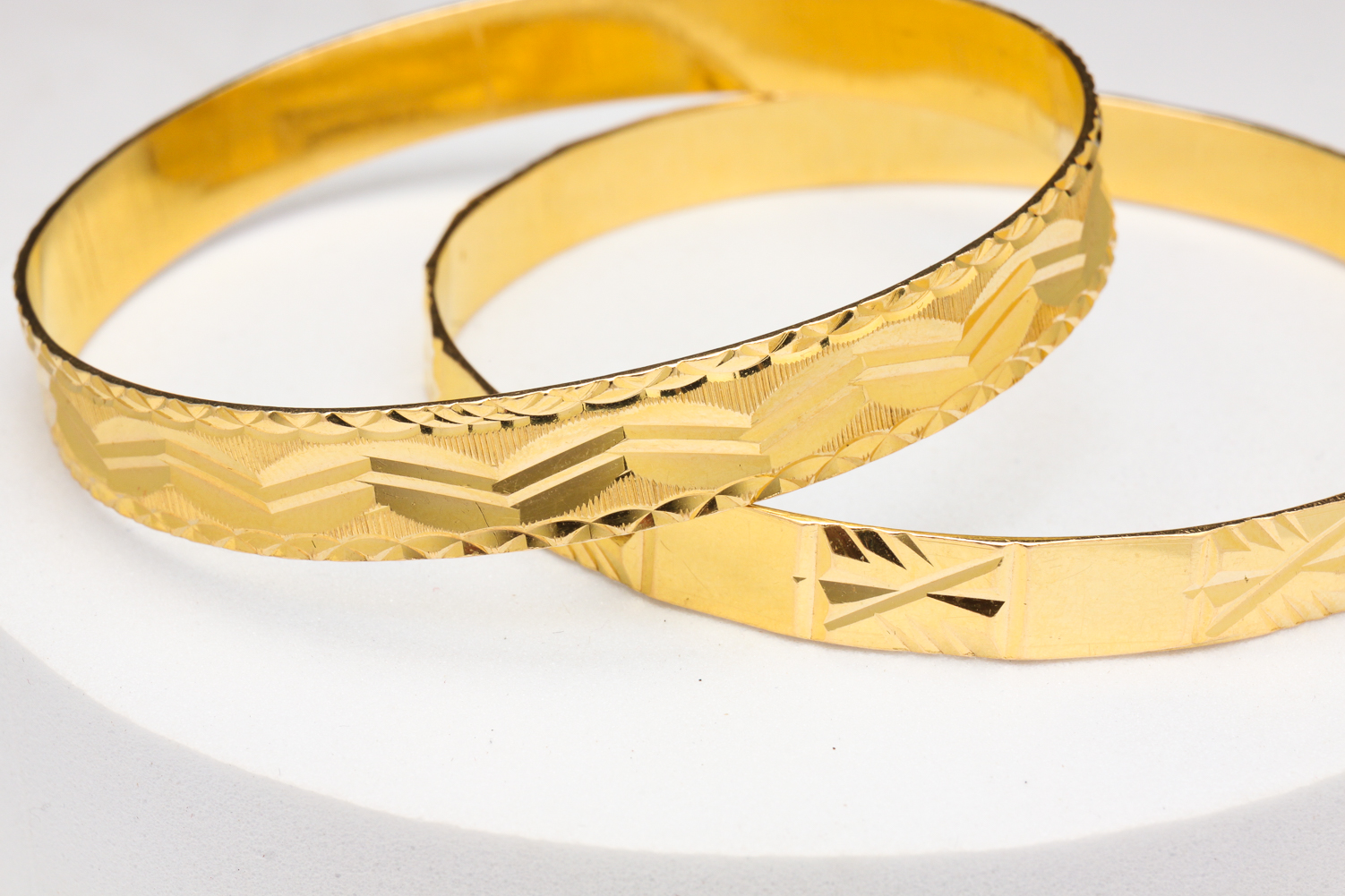 TWO HIGH KARAT GOLD BANGLE