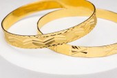 TWO HIGH KARAT GOLD BANGLE BRA