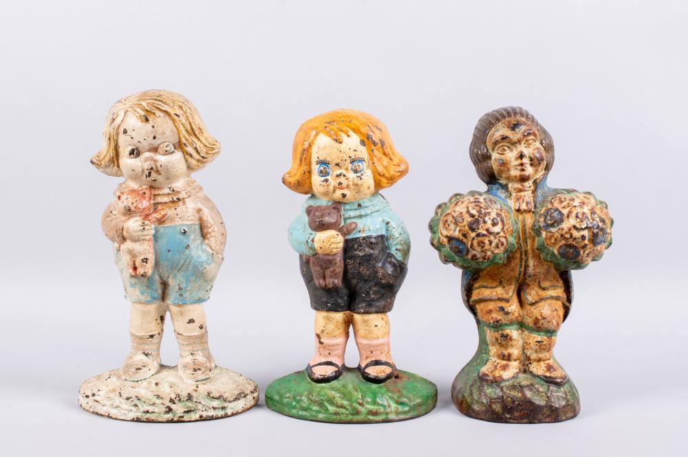 TWO HUBLEY CAST IRON DOORSTOPS OF