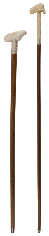 TWO INUIT CARVED CANESTWO INUI