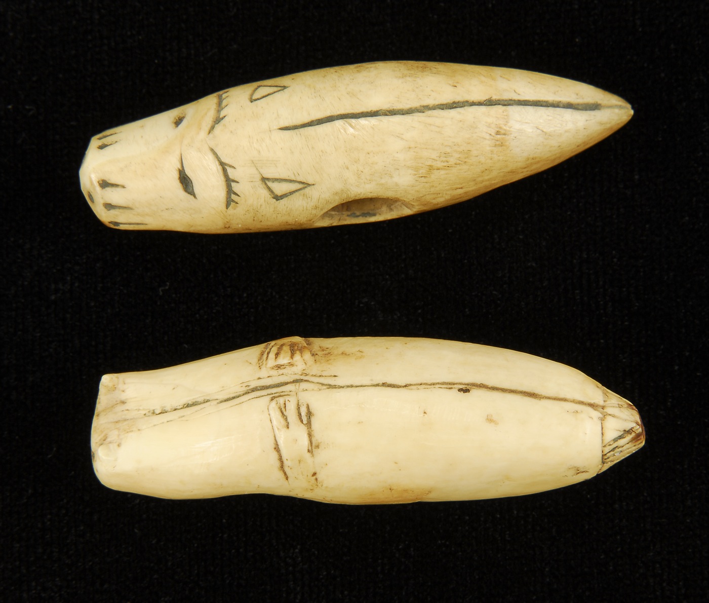 TWO INUIT CARVED SEAL-FORM