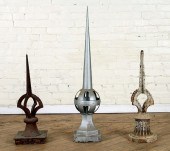 TWO IRON FINIALS AND ONE ZINC