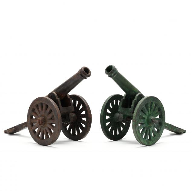 TWO IRON MINIATURE CANNONS 