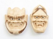 * Two Ivory Oni Mask Netsukes