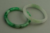 TWO JADE BANGLE BRACELETSTWO J