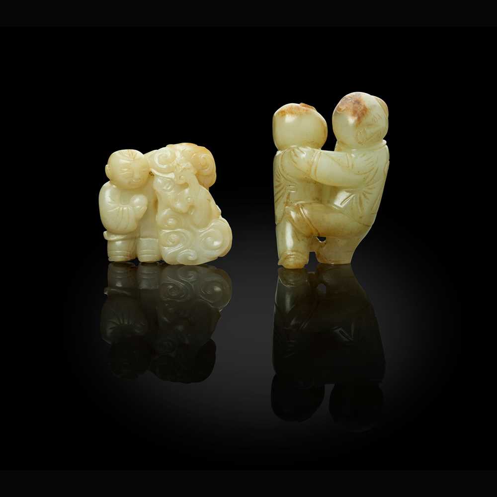 TWO JADE CARVINGS OF BOYS AT PLAY