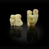 TWO JADE CARVINGS OF BOYS AT P