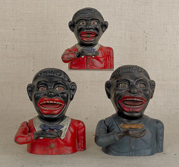 Two jolly black men cast iron