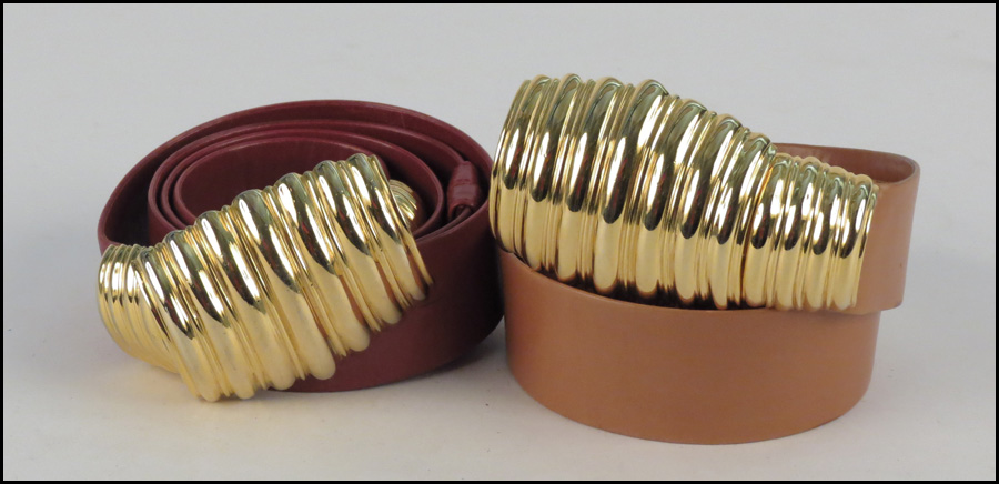 TWO JUDITH LEIBER LEATHER BELTS.