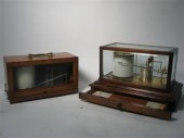 Two mahogany and glass case ta