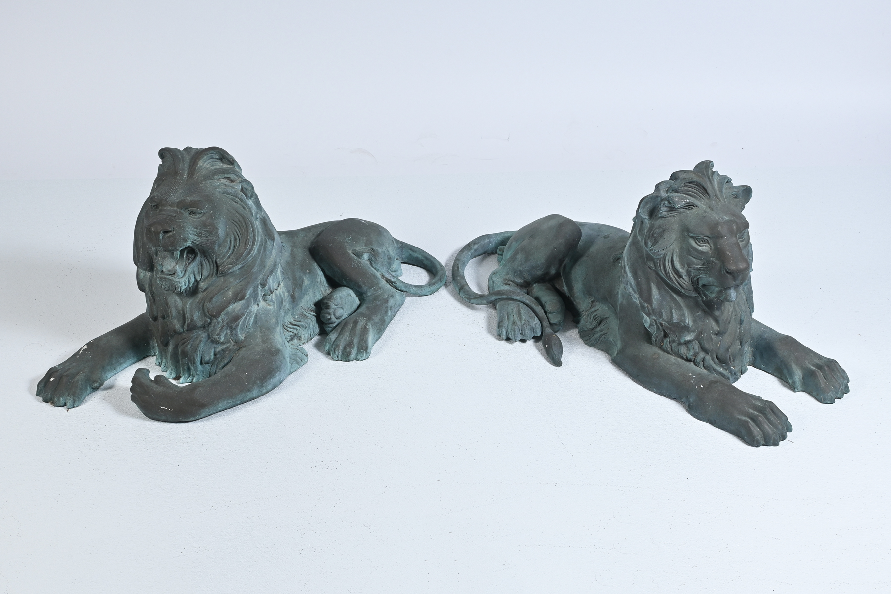 TWO MAJESTIC RECUMBENT BRONZE