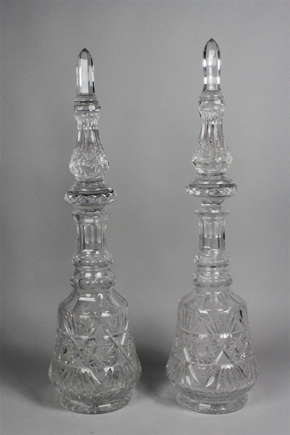 TWO MASSIVE CUT GLASS DECANTERS