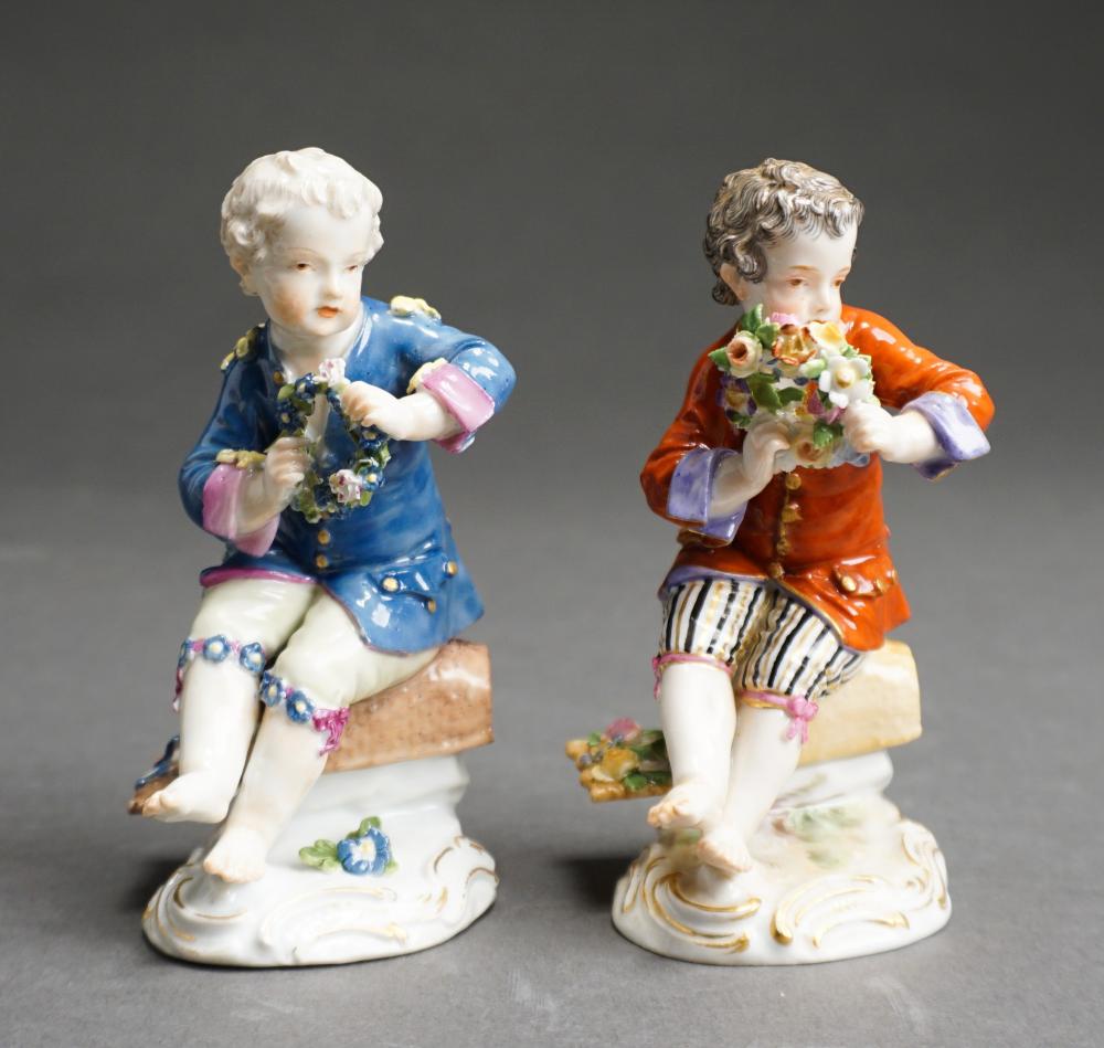 TWO MEISSEN FIGURINES OF SEATED BOY