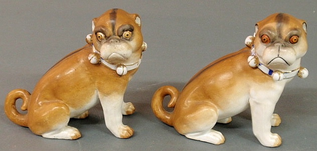 Two Meissen seated pug dogs