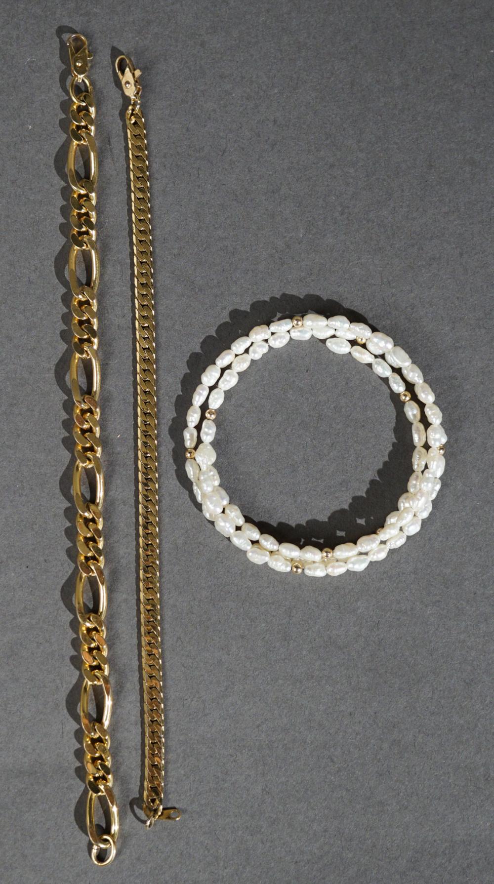TWO METAL BRACELETS AND A BAROQUE