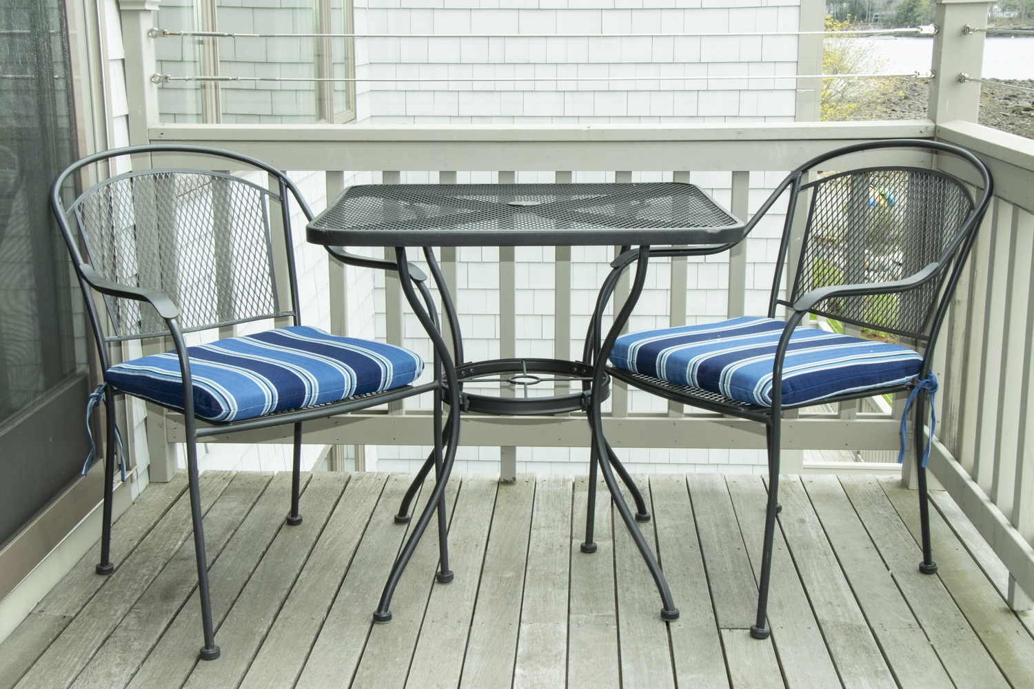 TWO METAL LATTICE PATIO TABLES WITH