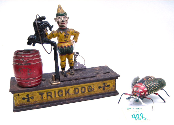 TWO METAL TOYS cast iron ''Trick