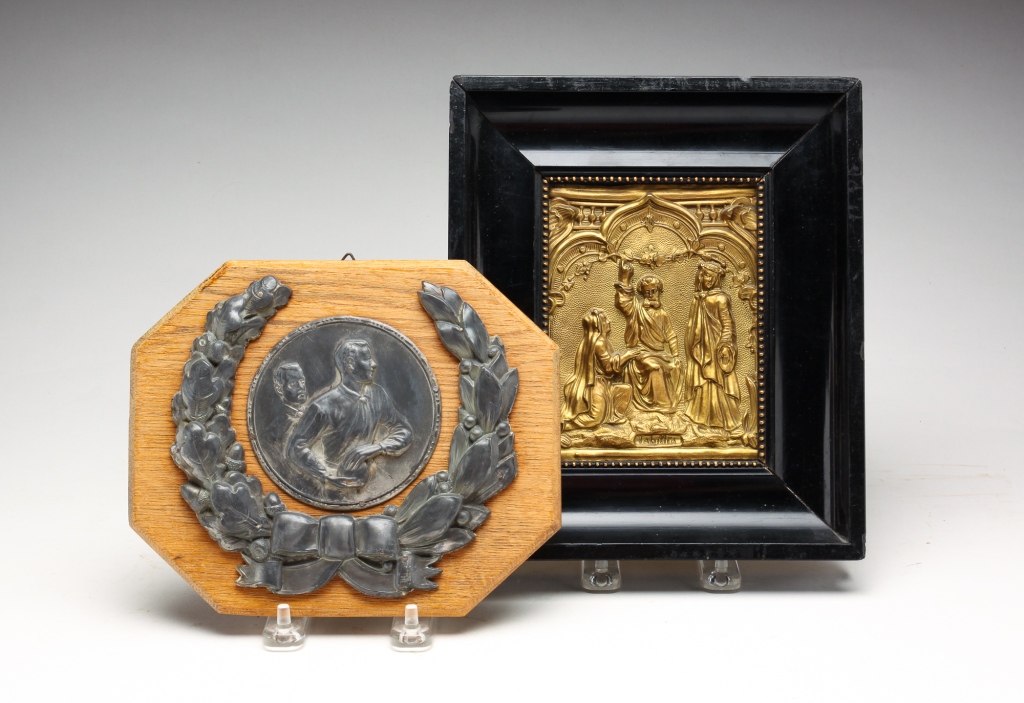 TWO METAL WALL PLAQUES. First