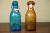 TWO MILK BOTTLES. One amber  t