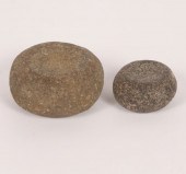 Two miniature discoidals. Larg