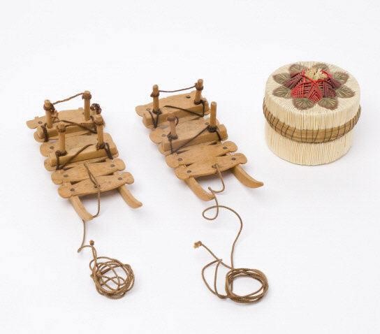 TWO MINIATURE GRENFELL SLEDGES &